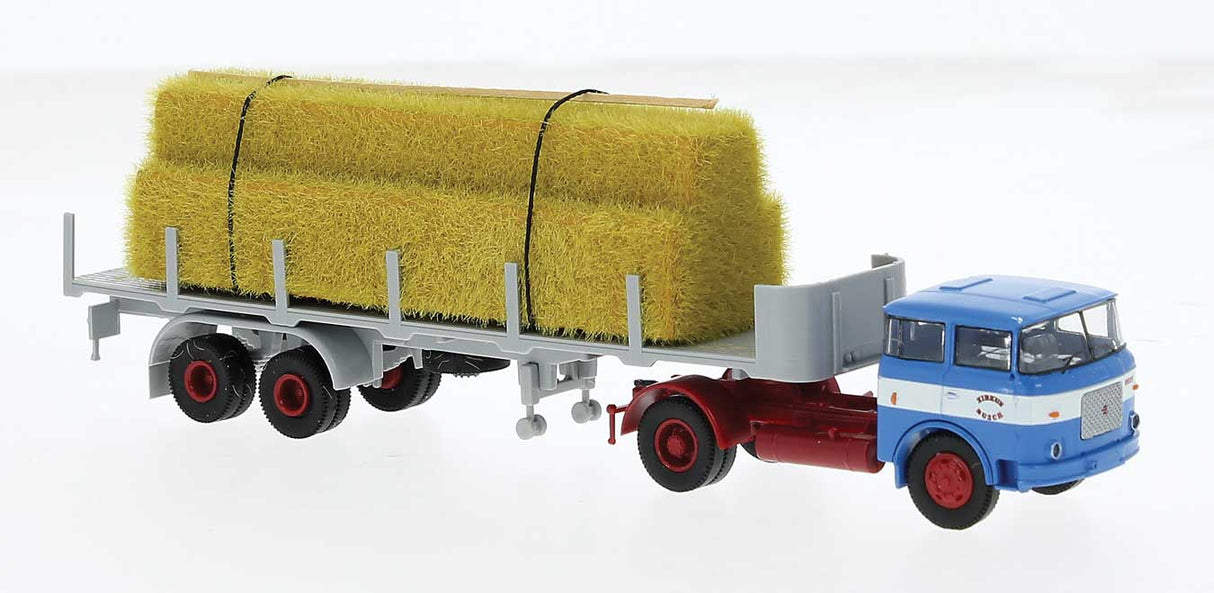 PREORDER Brekina HO 71832 1957-1987 Skoda-LIAZ 706 Tractor with Stake Flatbed Trailer Hay Load, Assembl, Circus Busch (blue, gray, red, white, German Lettering)